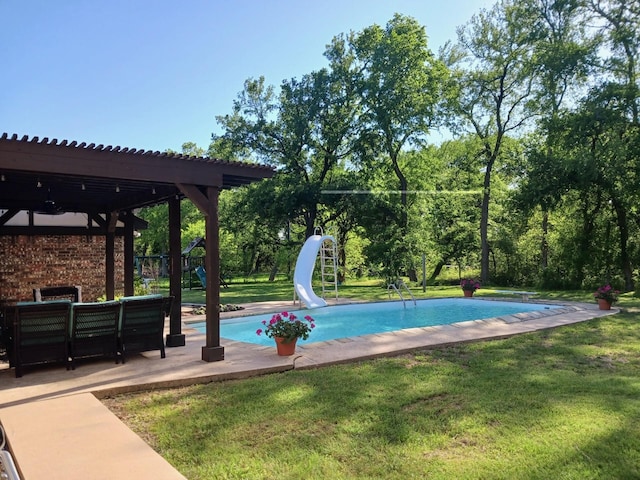 12 Brookhaven Dr, Lucas, TX 75002 - outdoor pool with a water slide, a yard, a diving board, an outdoor living space, and a patio