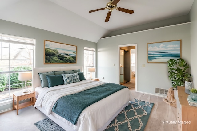 bedroom featuring lofted ceiling, light hardwood / wood-style floors, and ceiling fan