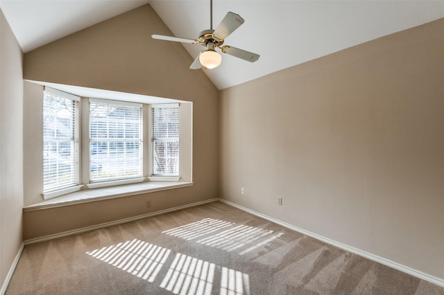 unfurnished room featuring light carpet, high vaulted ceiling, and ceiling fan