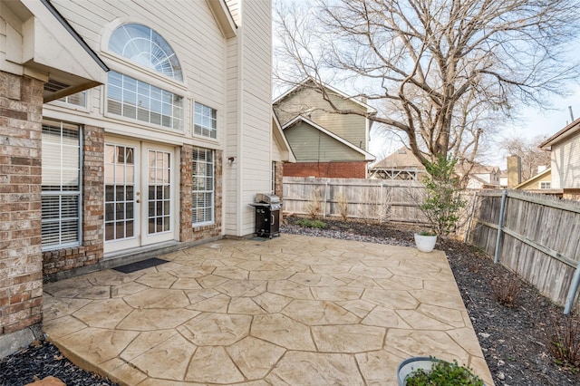 view of patio with area for grilling and french doors