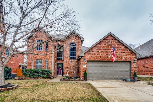 traditional home with an attached garage, a front lawn, concrete driveway, and brick siding