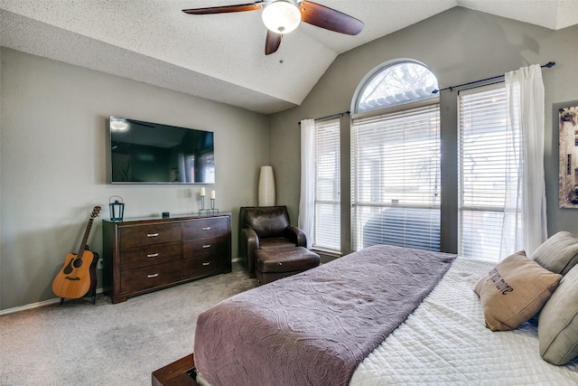 bedroom featuring lofted ceiling, light colored carpet, and ceiling fan