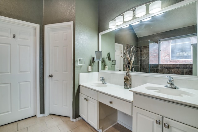 bathroom with tile patterned flooring and vanity