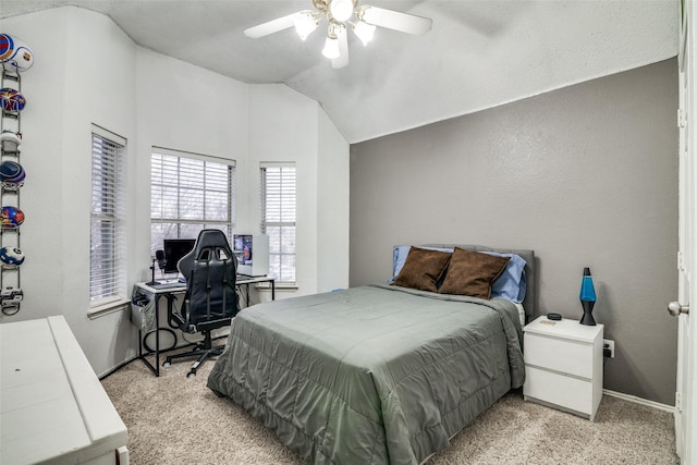 bedroom with lofted ceiling, light colored carpet, and ceiling fan