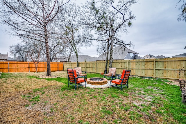 view of yard with a fire pit