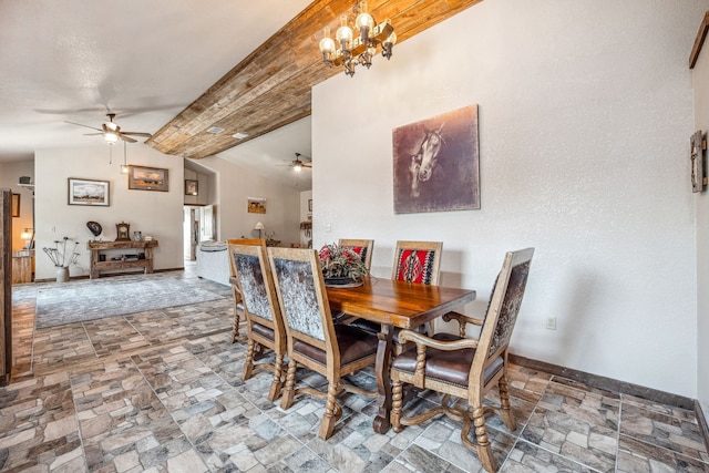 dining area with vaulted ceiling and ceiling fan with notable chandelier