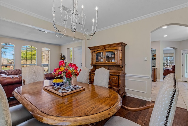 dining room featuring wood-type flooring and ornamental molding