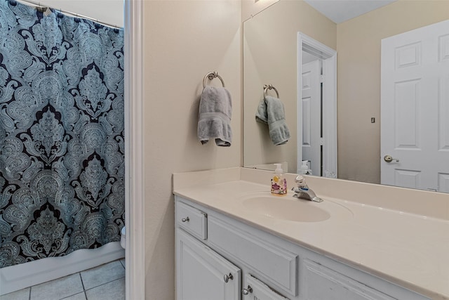 bathroom featuring vanity, curtained shower, and tile patterned floors