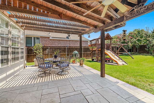 view of patio / terrace featuring a playground, grilling area, and a pergola