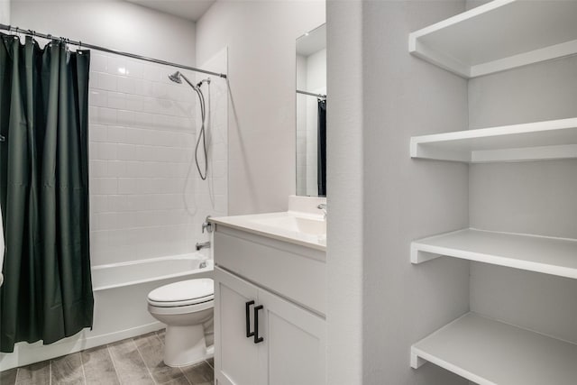 full bathroom with shower / tub combo, vanity, and toilet