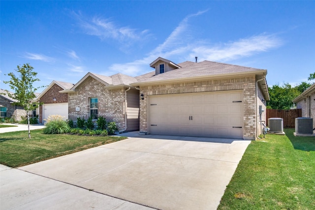 ranch-style house with a garage, a front lawn, and central air condition unit