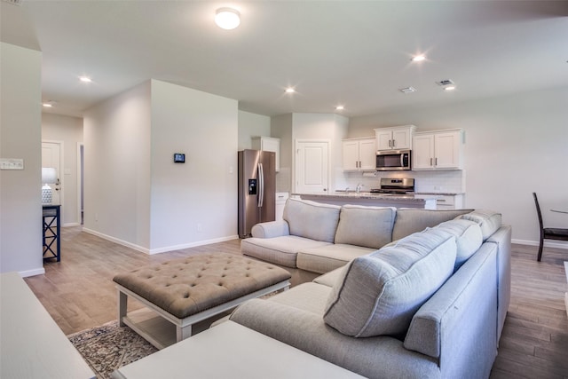 living room with light wood-type flooring