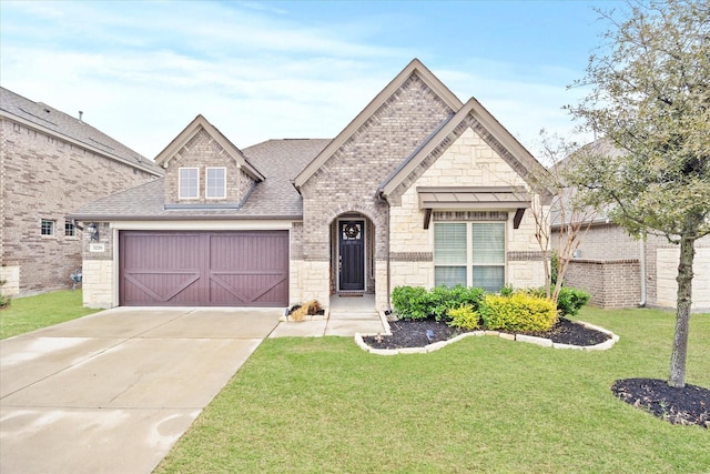 view of front of house with a garage and a front yard