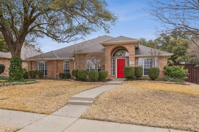 single story home with a front yard