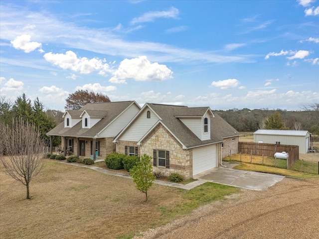 view of front of house with a garage, a porch, and a front lawn