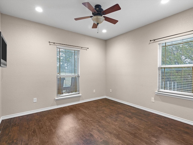 empty room featuring hardwood / wood-style flooring and ceiling fan