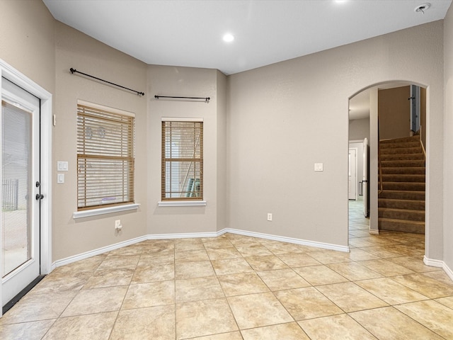 unfurnished room with light tile patterned floors