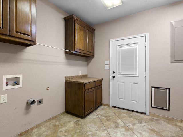 washroom with cabinets, washer hookup, hookup for an electric dryer, and electric panel