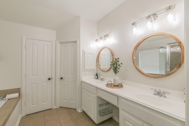 bathroom featuring tile patterned flooring and vanity