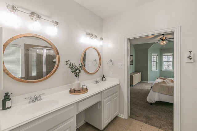 bathroom featuring tile patterned flooring, vanity, an enclosed shower, and ceiling fan