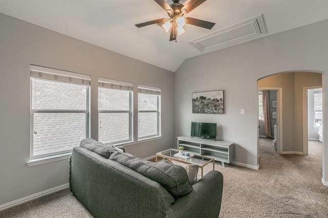 living room with vaulted ceiling, carpet, and ceiling fan