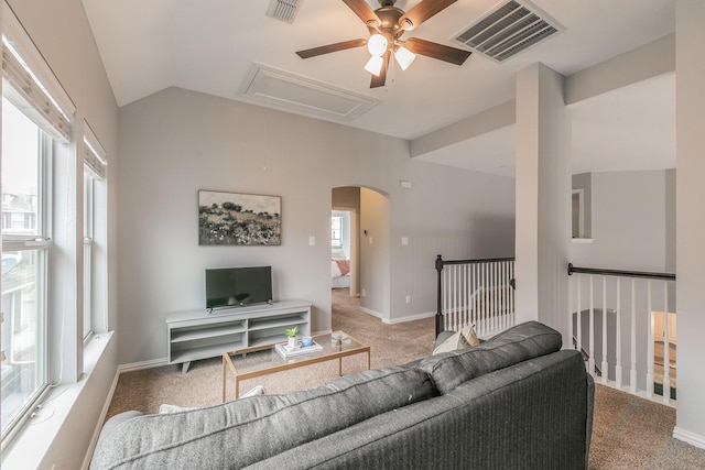 carpeted living room with lofted ceiling