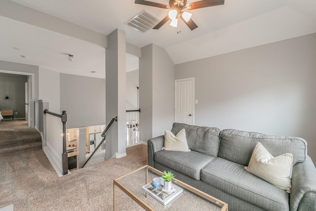 living room with vaulted ceiling, ceiling fan, and carpet flooring