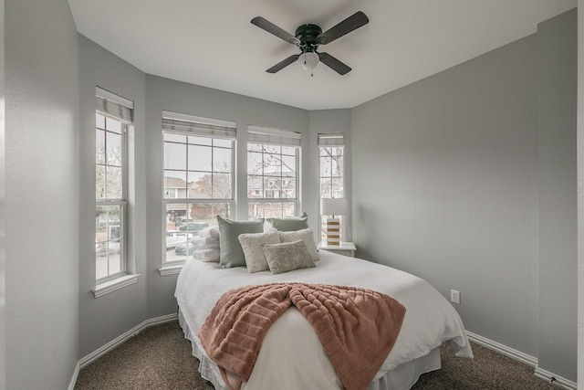 bedroom with ceiling fan and carpet flooring