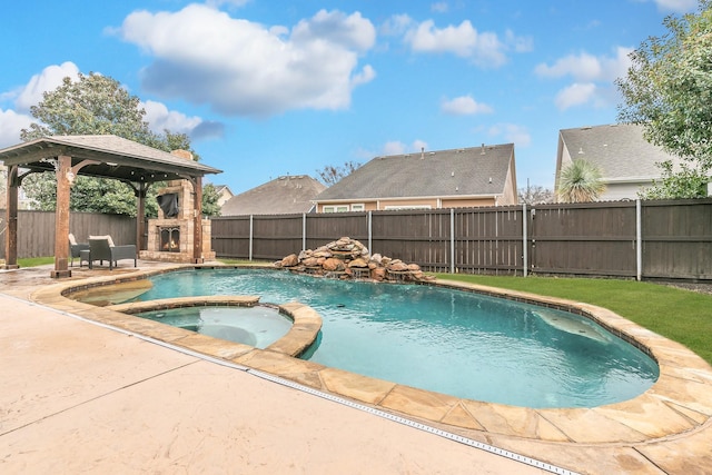 view of swimming pool featuring a gazebo, an in ground hot tub, an outdoor stone fireplace, and a patio