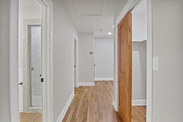 4101 Cole St, Fort Worth, TX 76115 - hallway featuring attic access, light wood finished floors, and baseboards