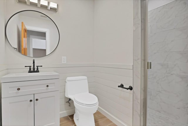 4101 Cole St, Fort Worth, TX 76115 - full bathroom with a shower stall, vanity, toilet, and wainscoting
