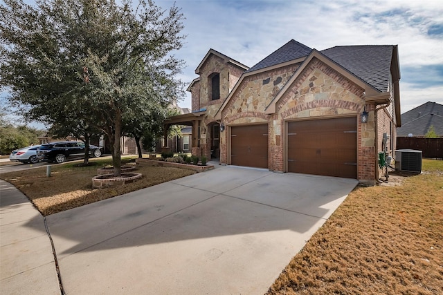 view of front of house featuring central AC and a garage