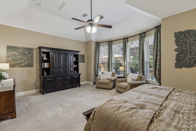 bedroom featuring lofted ceiling, baseboards, visible vents, and light colored carpet