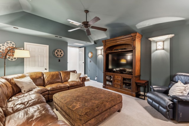 living area with light carpet, ceiling fan, and lofted ceiling