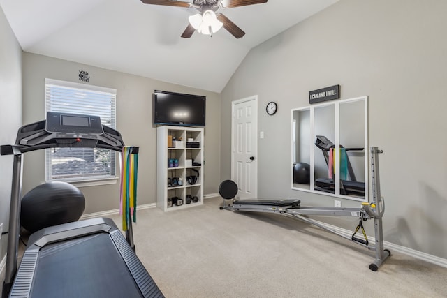 exercise room featuring carpet, baseboards, vaulted ceiling, and a ceiling fan