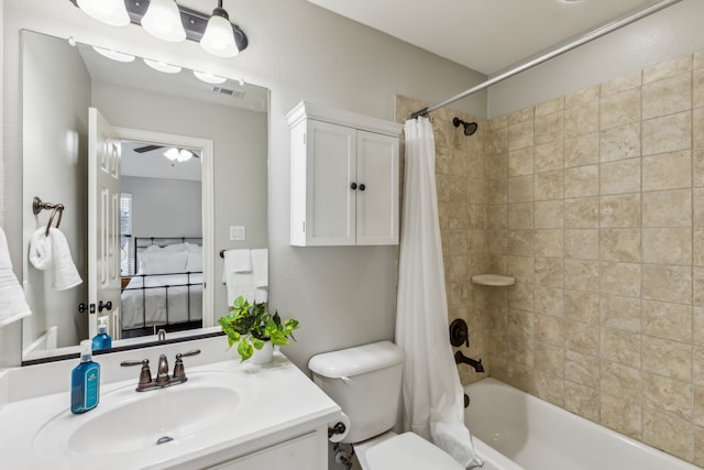 full bath featuring shower / tub combo, visible vents, connected bathroom, toilet, and vanity