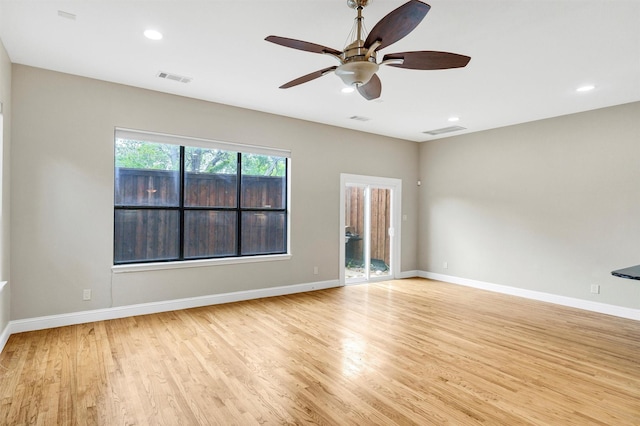 6039 Reiger Ave, Dallas, TX 75214 - empty room featuring light wood-type flooring, baseboards, a ceiling fan, and visible vents
