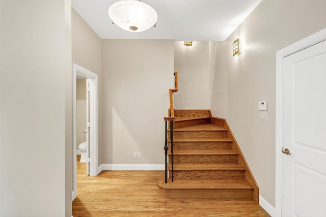 6039 Reiger Ave, Dallas, TX 75214 - stairway with baseboards and wood finished floors