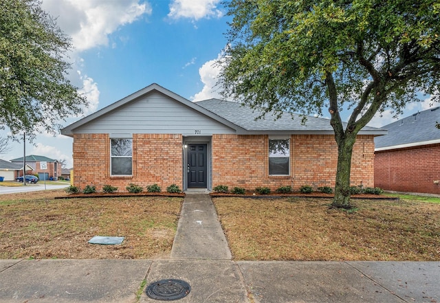 view of front of home with a front lawn