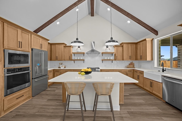 kitchen with open shelves, a sink, stainless steel appliances, light countertops, and wall chimney exhaust hood