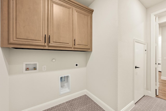 1130 Cardinal Dr, Midlothian, TX 76065 - washroom featuring hookup for an electric dryer, hookup for a gas dryer, cabinet space, hookup for a washing machine, and baseboards