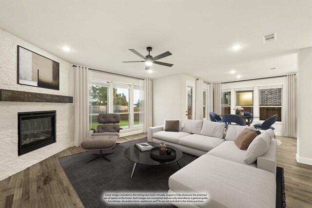 1130 Cardinal Dr, Midlothian, TX 76065 - living room featuring a ceiling fan, a stone fireplace, wood finished floors, and recessed lighting