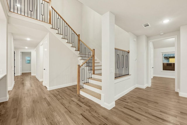 1130 Cardinal Dr, Midlothian, TX 76065 - staircase with wood finished floors, baseboards, healthy amount of natural light, and recessed lighting