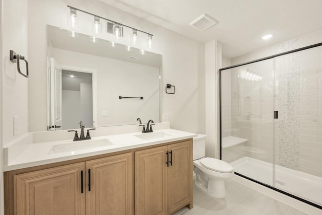 1130 Cardinal Dr, Midlothian, TX 76065 - bathroom featuring double vanity, toilet, and a shower stall