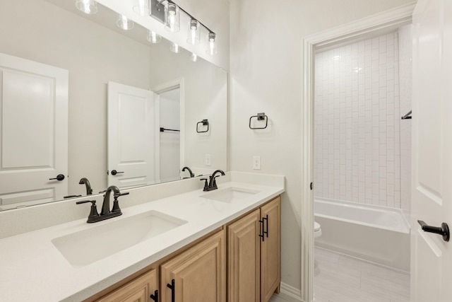 1130 Cardinal Dr, Midlothian, TX 76065 - bathroom featuring double vanity, toilet, and bathtub / shower combination