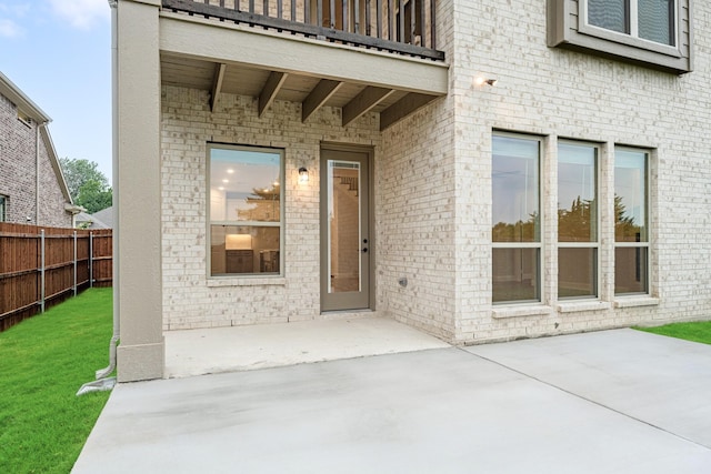 1130 Cardinal Dr, Midlothian, TX 76065 - view of exterior entry featuring a patio area and brick siding