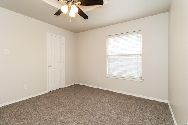 unfurnished room featuring ceiling fan and carpet flooring