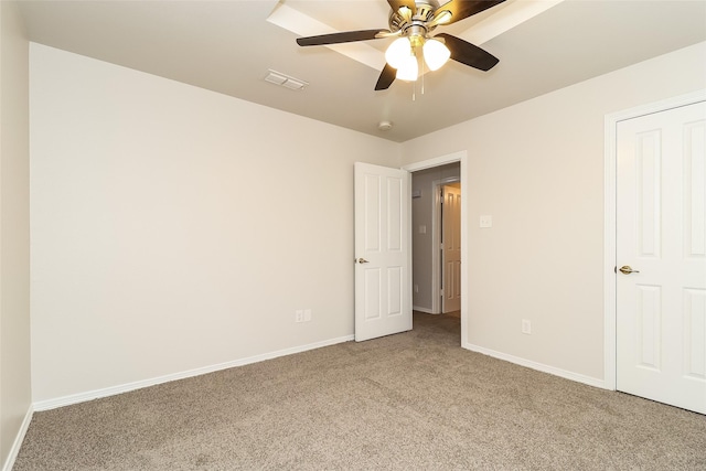 unfurnished bedroom with ceiling fan and carpet flooring