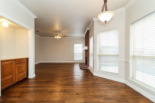 unfurnished living room with ornamental molding, dark hardwood / wood-style floors, and ceiling fan