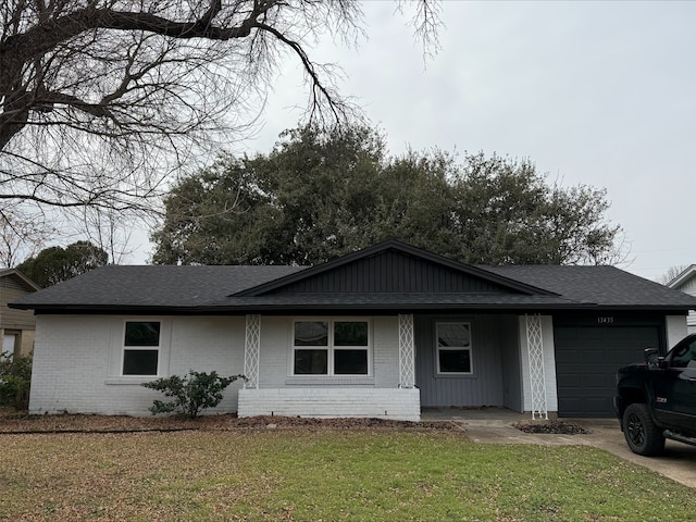 ranch-style house with a garage and a front yard